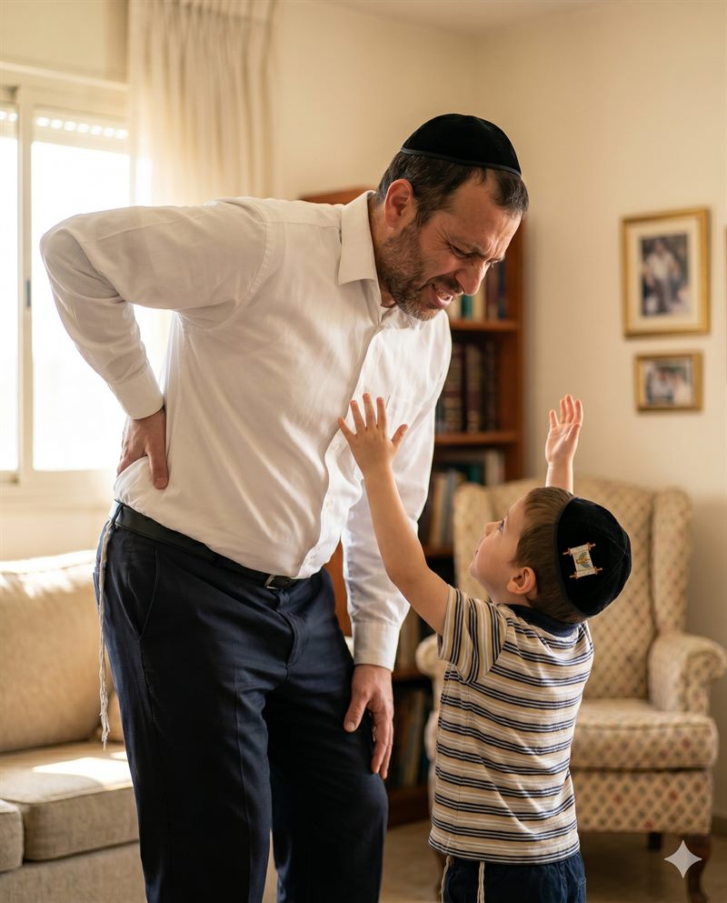 אבא חרדי עם כאבי גב מתקשה להרים את הילד שלו